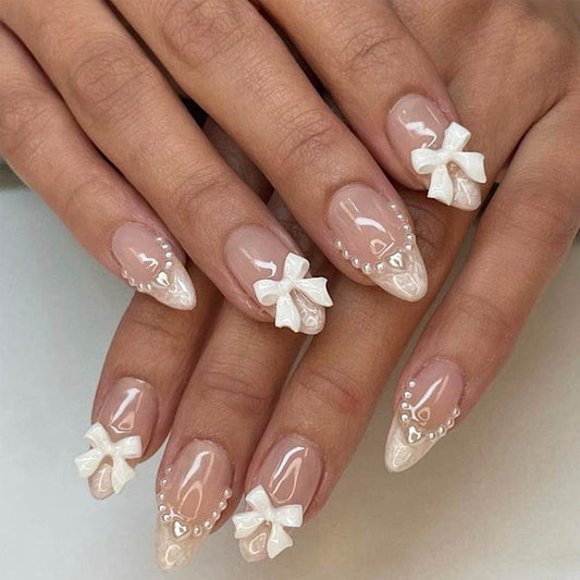 24Pcs Almond Press on Nails French Tips Short Fake Nails with Cute Bow Charms Design French Press on False Nails Nude Pink Acrylic Nails Almond Shaped Artificial Nails for Women Girls Manicure Tip